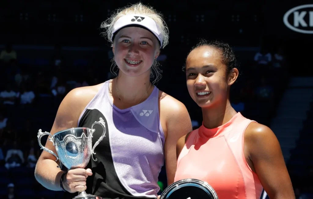 Denmark's Clara Tauson, positioned on the left, holds her trophy after triumphing over Canada's Leylah Annie Fernandez in the Australian Open's girls' singles final.