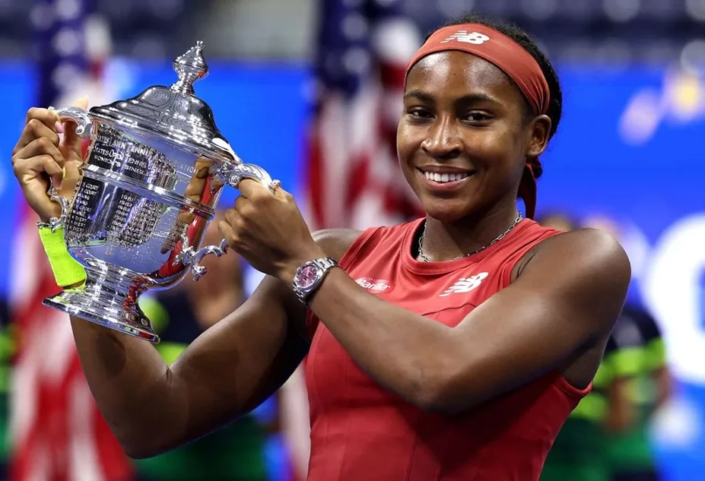 Victorious Coco Gauff with the US Open championship trophy.