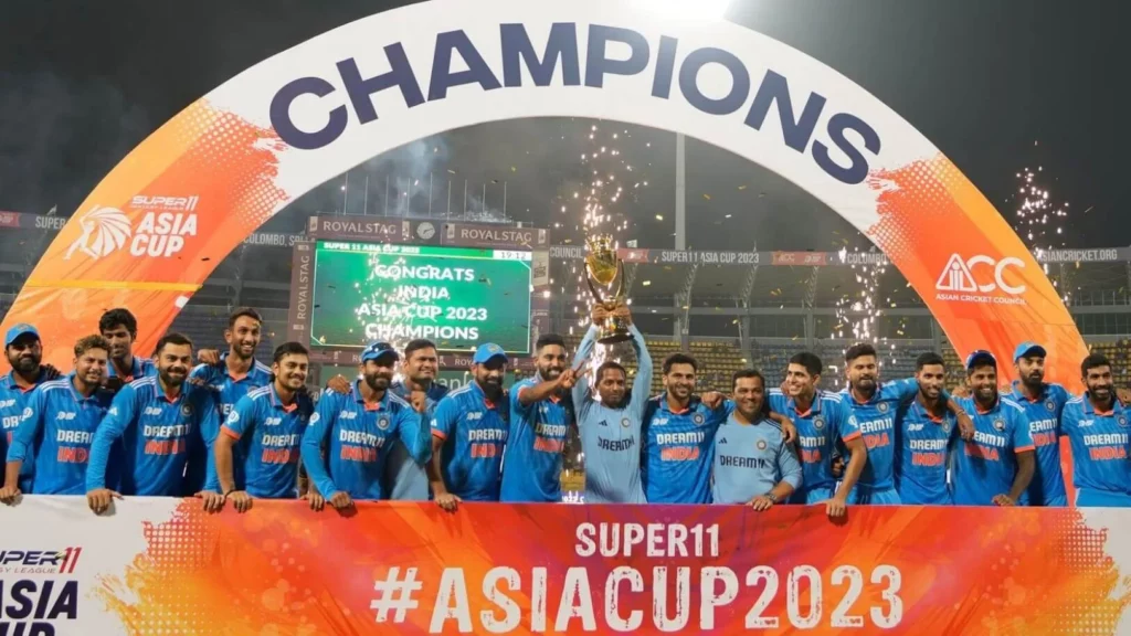 Indian cricket team members holding their Asia Cup 2023 trophy.