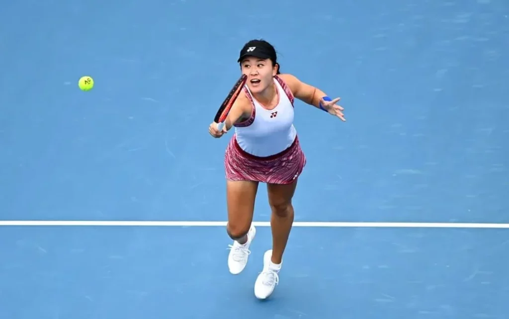Lin Zhu showcasing her athleticism and skill during a match.