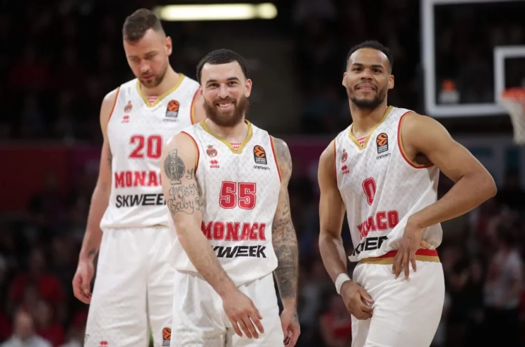 Monaco basketball team players in action during a game.