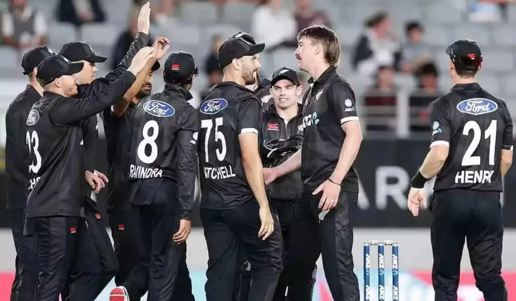 New Zealand cricket players celebrating a crucial wicket.