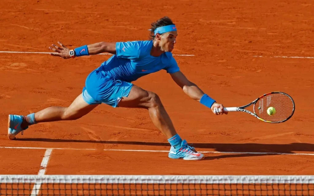 Rafael Nadal in action during a tennis match.