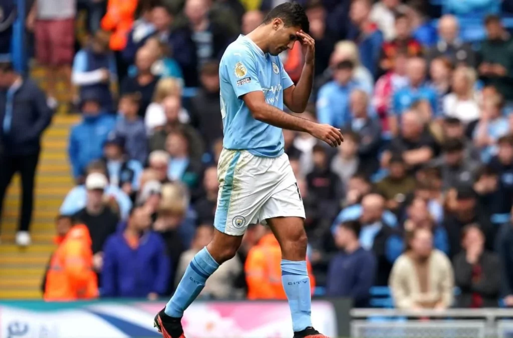 Rodri, visibly upset, post-red card issuance.