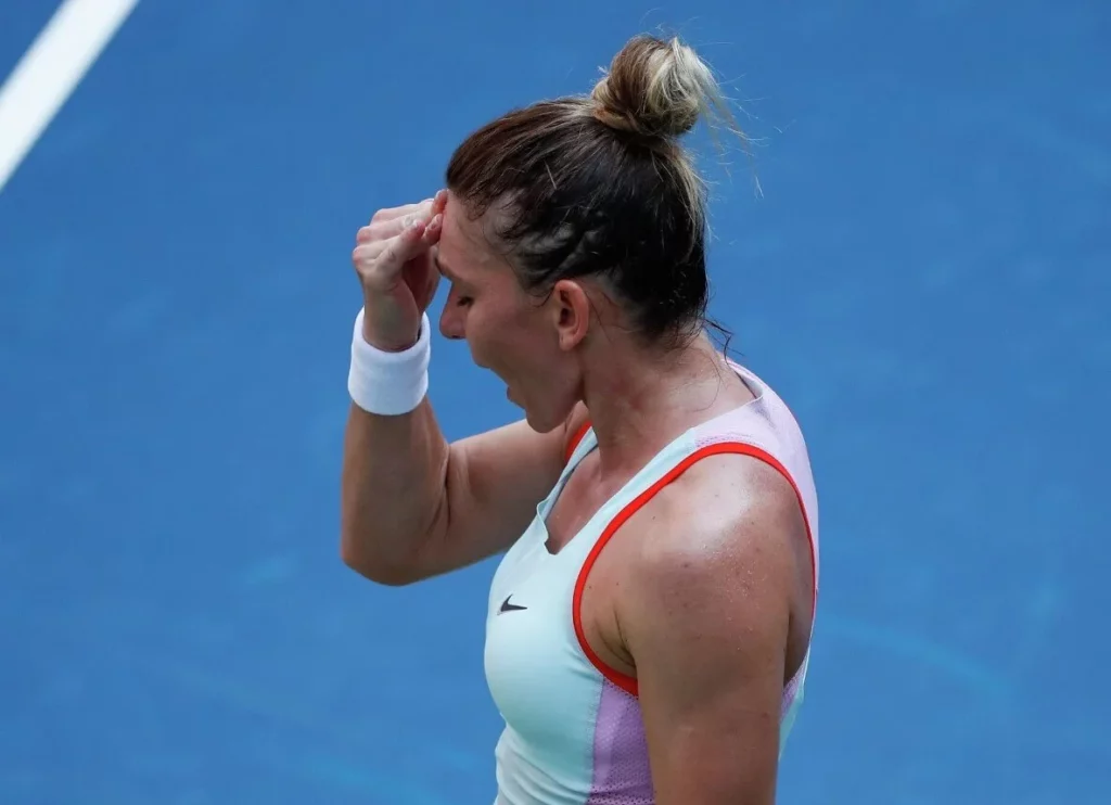 A visibly upset Simona Halep during a tennis match.