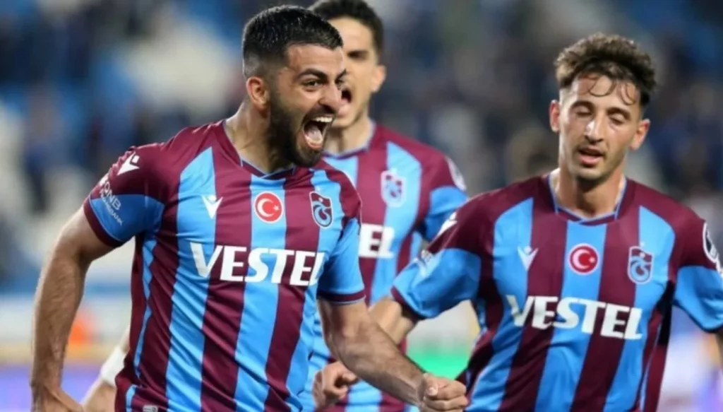 Euphoric reaction from Trabzonspor squad following a netted ball.