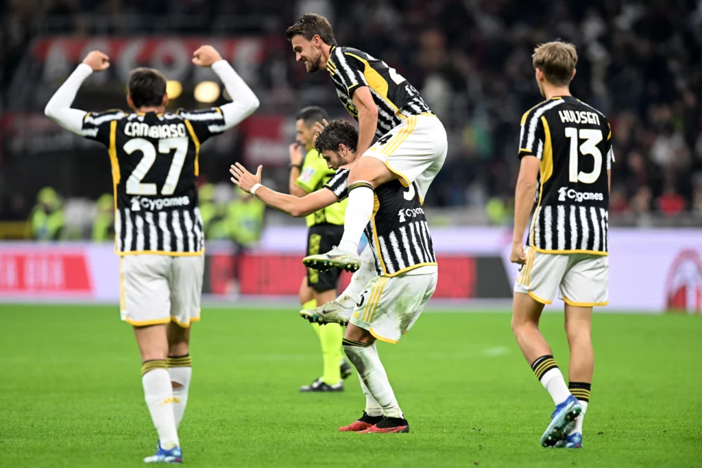 uventus midfielder Manuel Locatelli (centre) celebrates after the referee blew the final whistle.