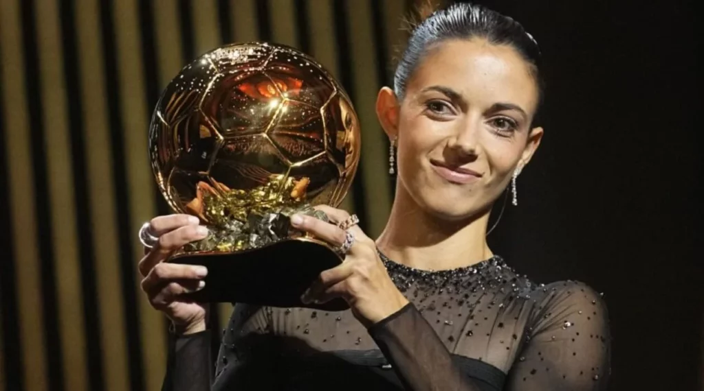 Aitana Bonmati proudly holding the Ballon d'Or trophy".