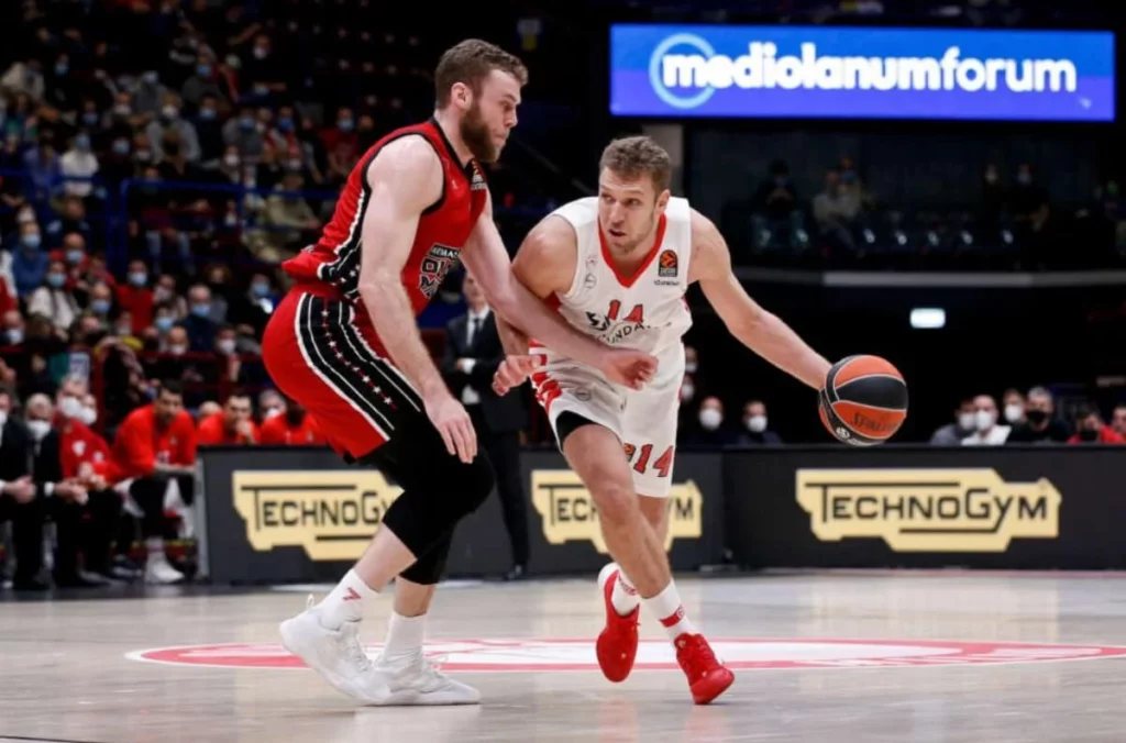 Alexander Vezenkov skillfully maneuvers past an opponent during a game.