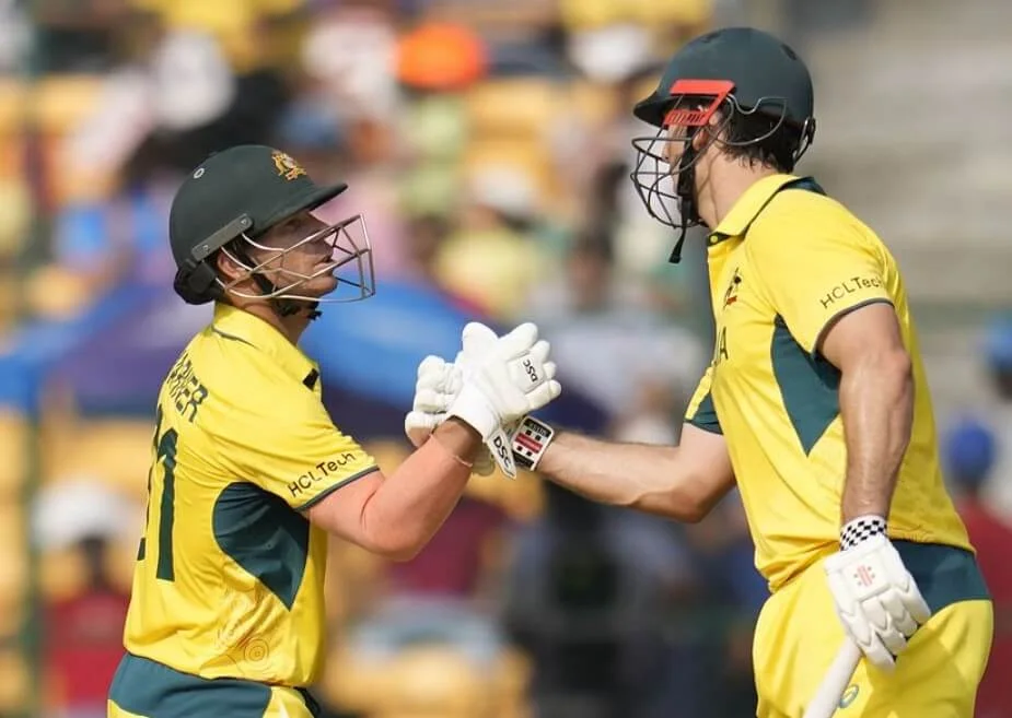 Australian cricketers David Warner and Mitchell Marsh in action.