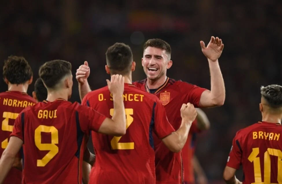 Spanish national team players celebrating a goal.