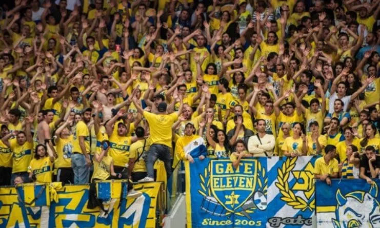 Loyal supporters of Maccabi Playtika displaying team spirit.