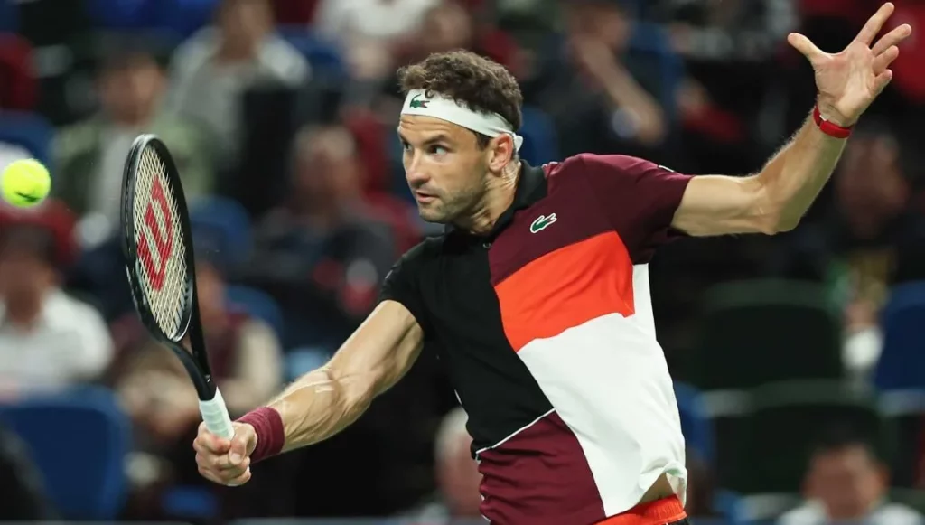 Grigor Dimitrov, showcasing his tennis skills on court.