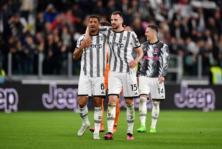 Juventus squad rejoicing after a successful match outcome.