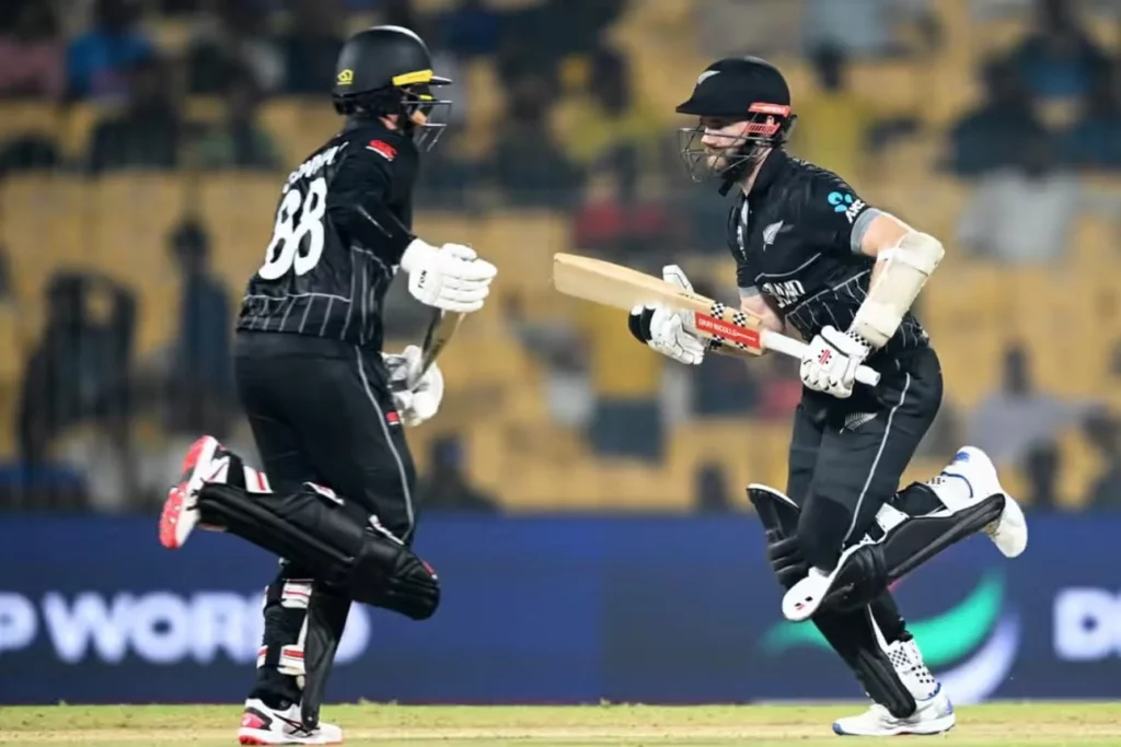 Kane Williamson (on the right) and Devon Conway make a run for New Zealand between the wickets.
