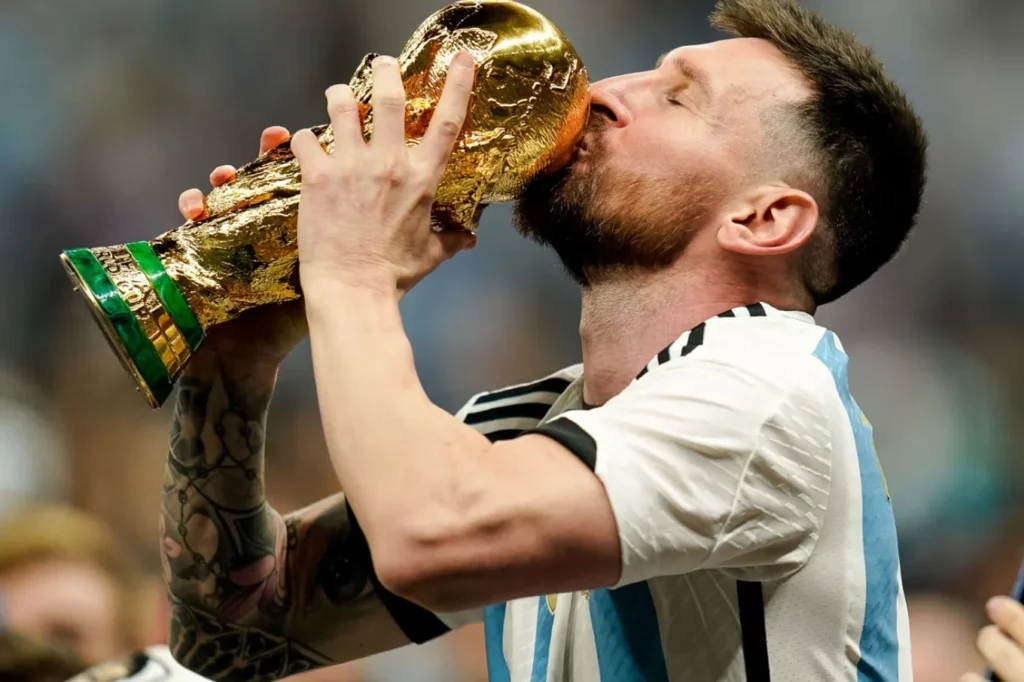 Lionel Messi holding the World Cup trophy.