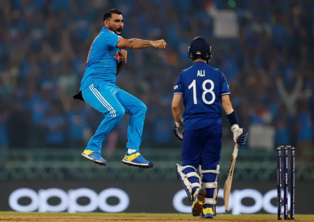 Mohammed Shami celebrating victory with a triumphant pose.