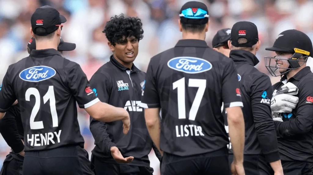 Key players from the Black Caps in a huddle on the cricket field.