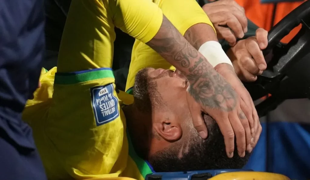 Football star Neymar awaiting medical attention after an in-game injury.