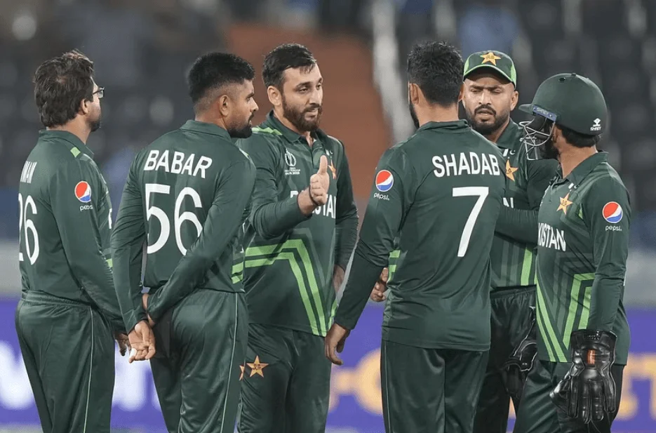 Team Pakistan in a strategic huddle on the cricket field.