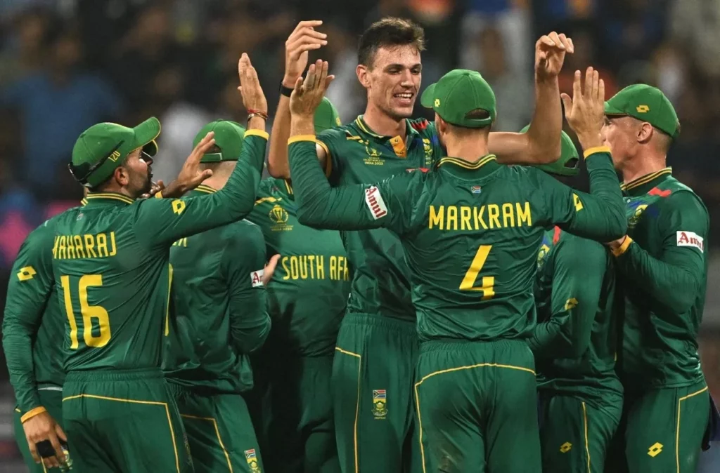 South Africa's cricket stars sharing a victorious moment on the pitch.
