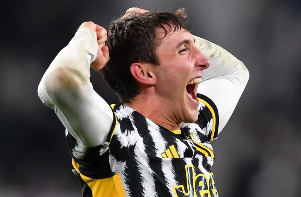 Delighted Juventus team member expressing triumph at the stadium.