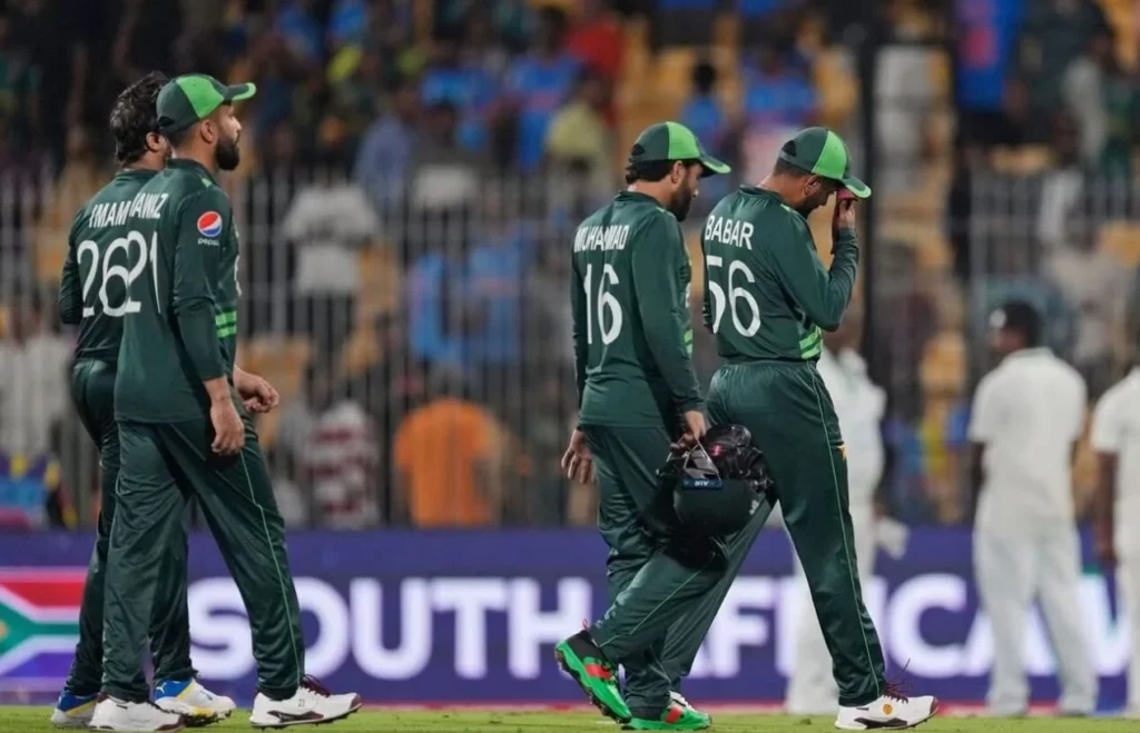 Cricket players from Pakistan showing disappointment on the field post-game.