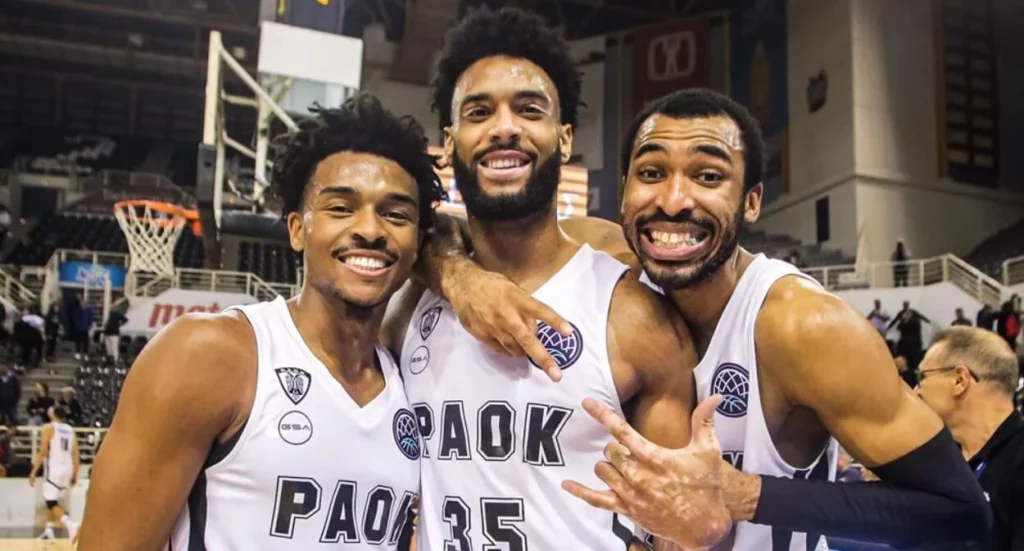 Cheerful PAOK players enjoying a light moment together.