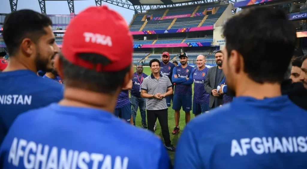 Cricket icon Sachin Tendulkar sharing tips with young players.