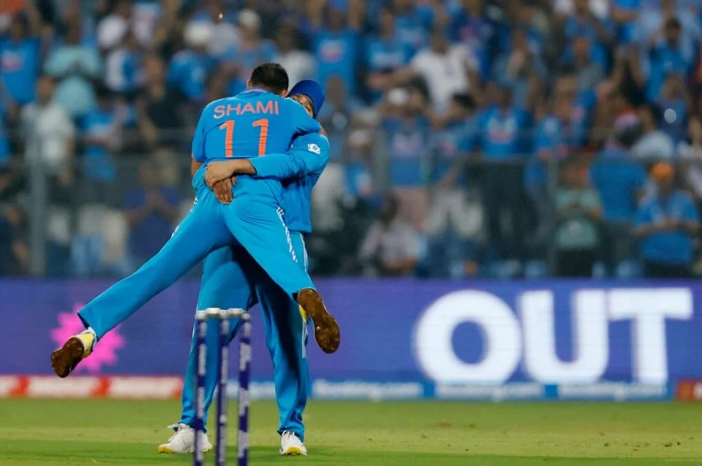 Victory moment for India as Shami and Sharma celebrate post Ferguson's wicket in the 2023 Cricket World Cup semifinal.