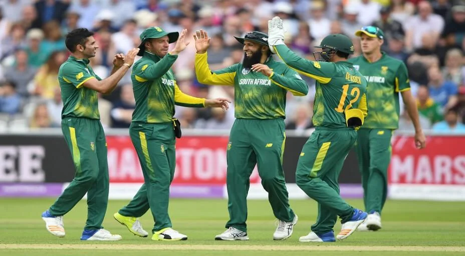 South African cricket team players in action on the field.