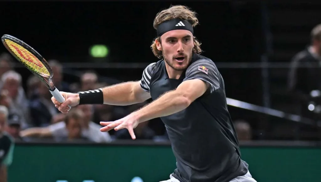 Stefanos Tsitsipas focused and ready to return the ball during a competitive game.