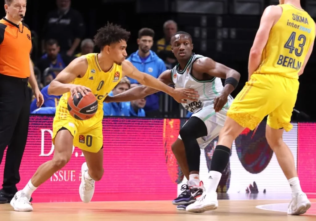 Alba Berlin player showcasing dribble mastery in game action.