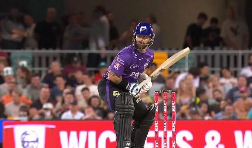 Cricket player from Hobart Hurricanes ready to strike in a T20 game.
