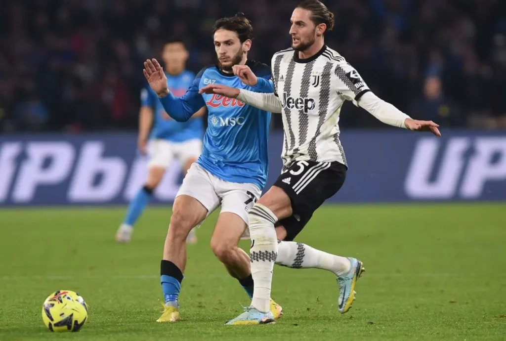 Dynamic play on the field in the high-stakes Juventus vs Napoli match.