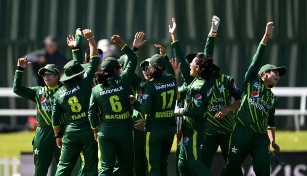 Team Pakistan Women on the field during a cricket match.